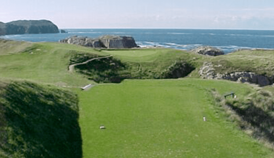 View of one of the holes at Cruit Island Golf Club with the sea in the background.